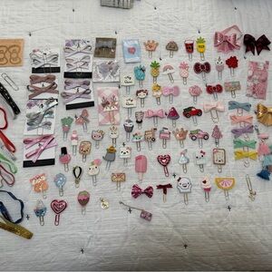 Huge lot of planner clips & bands. Multiple brands. Items are in two pictures.